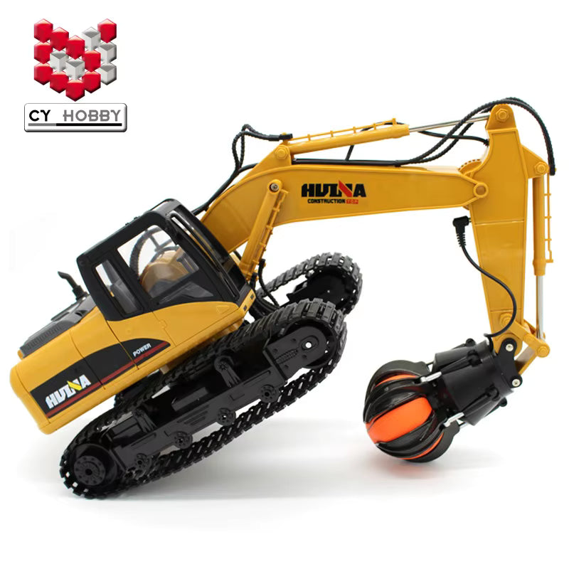 Huina RC excavator claw grabbing logs outdoor