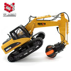 Huina RC excavator claw grabbing logs outdoor